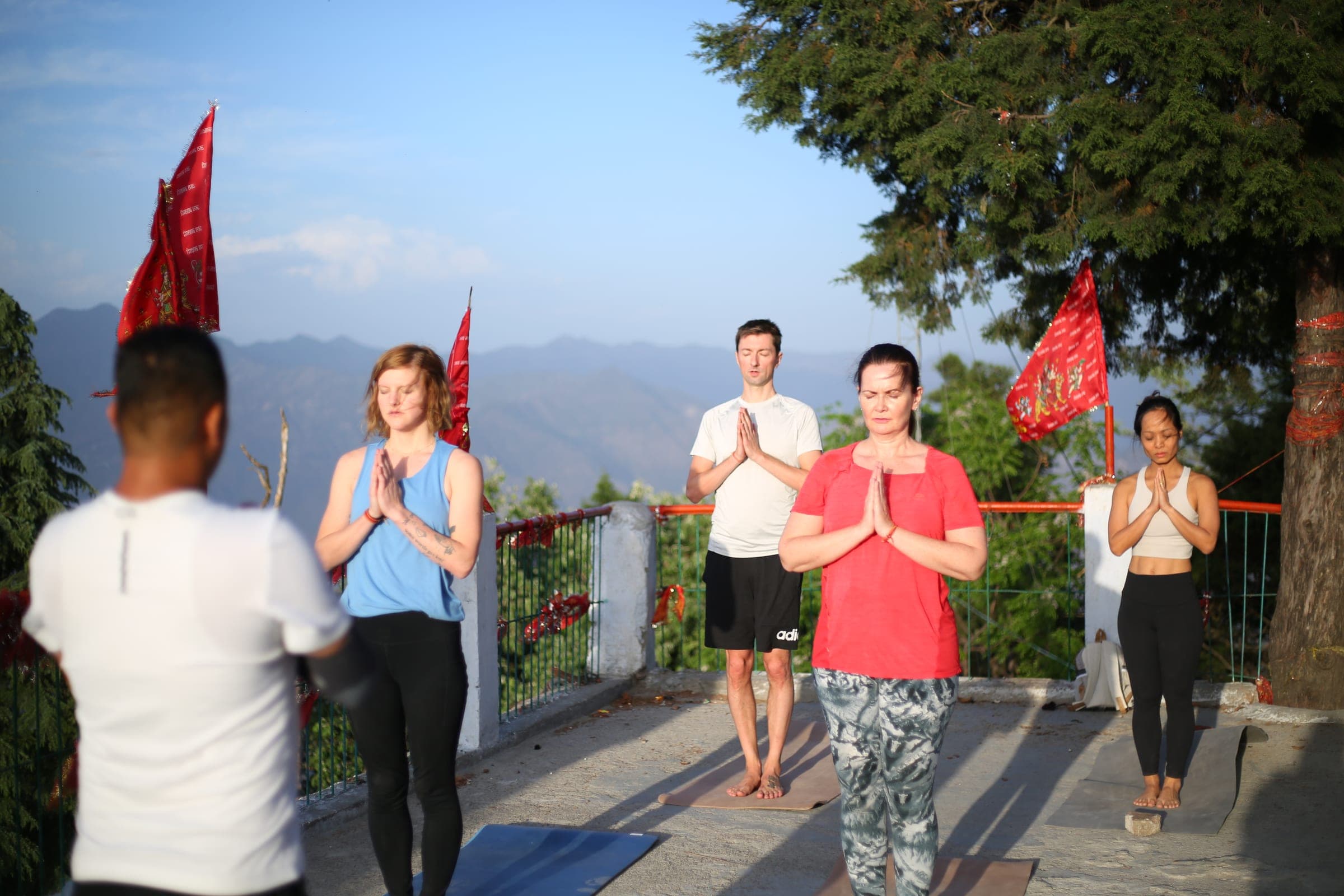 Namaste on the temple terrace at dawn