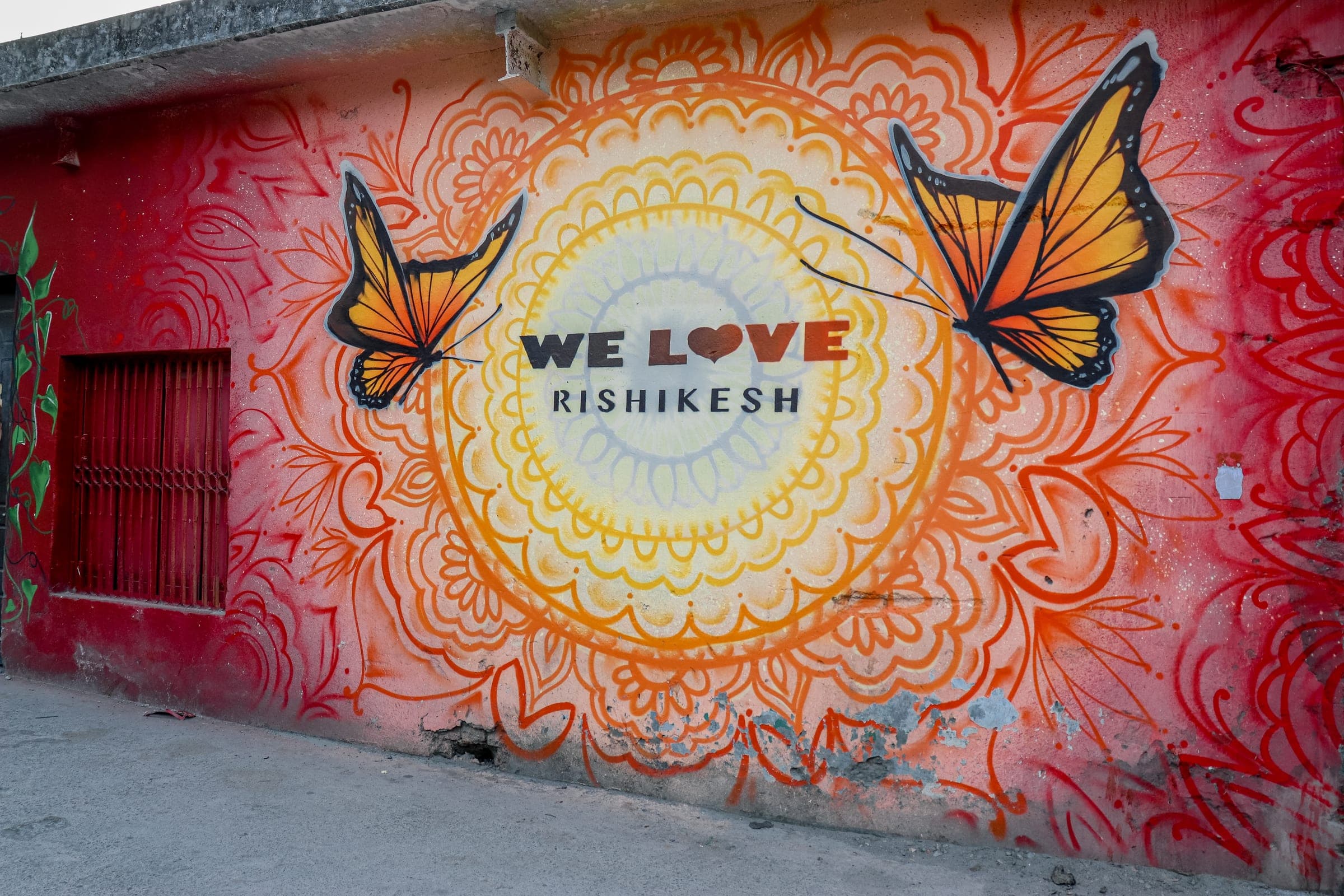 The We Love Rishikesh mural on a back lane