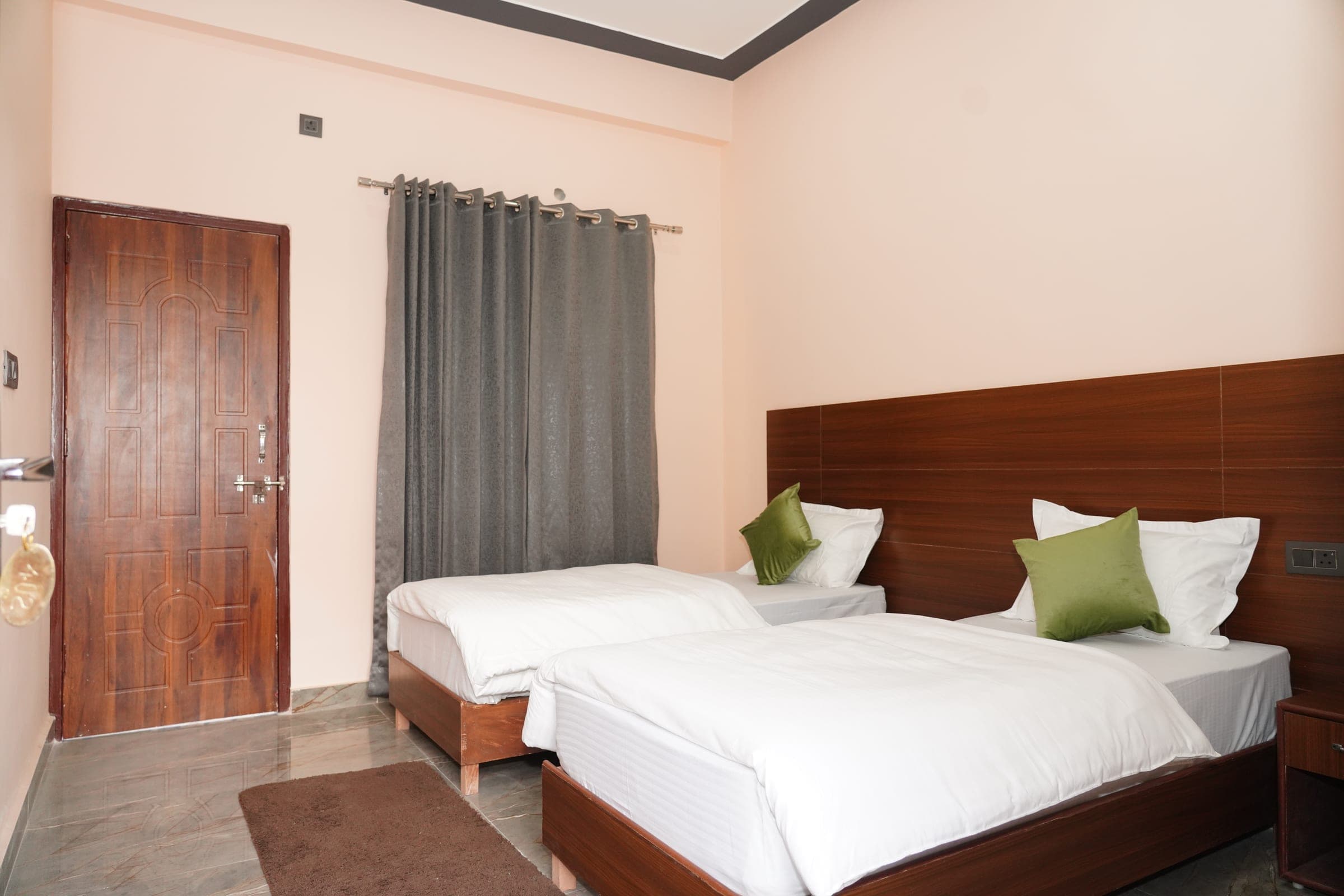 An air-conditioned sharing room, made up for two