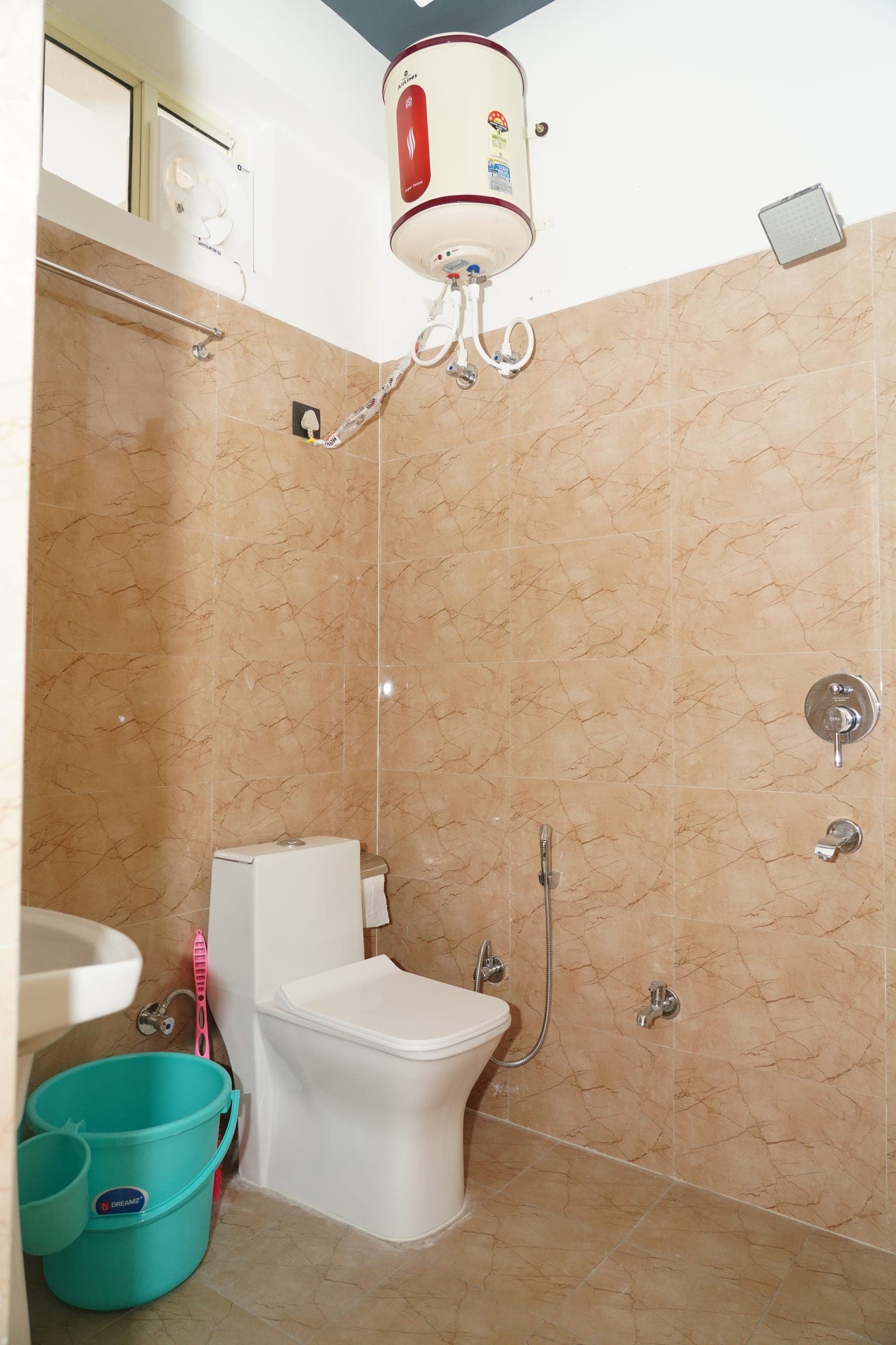 A water heater, an extractor fan and a window that opens