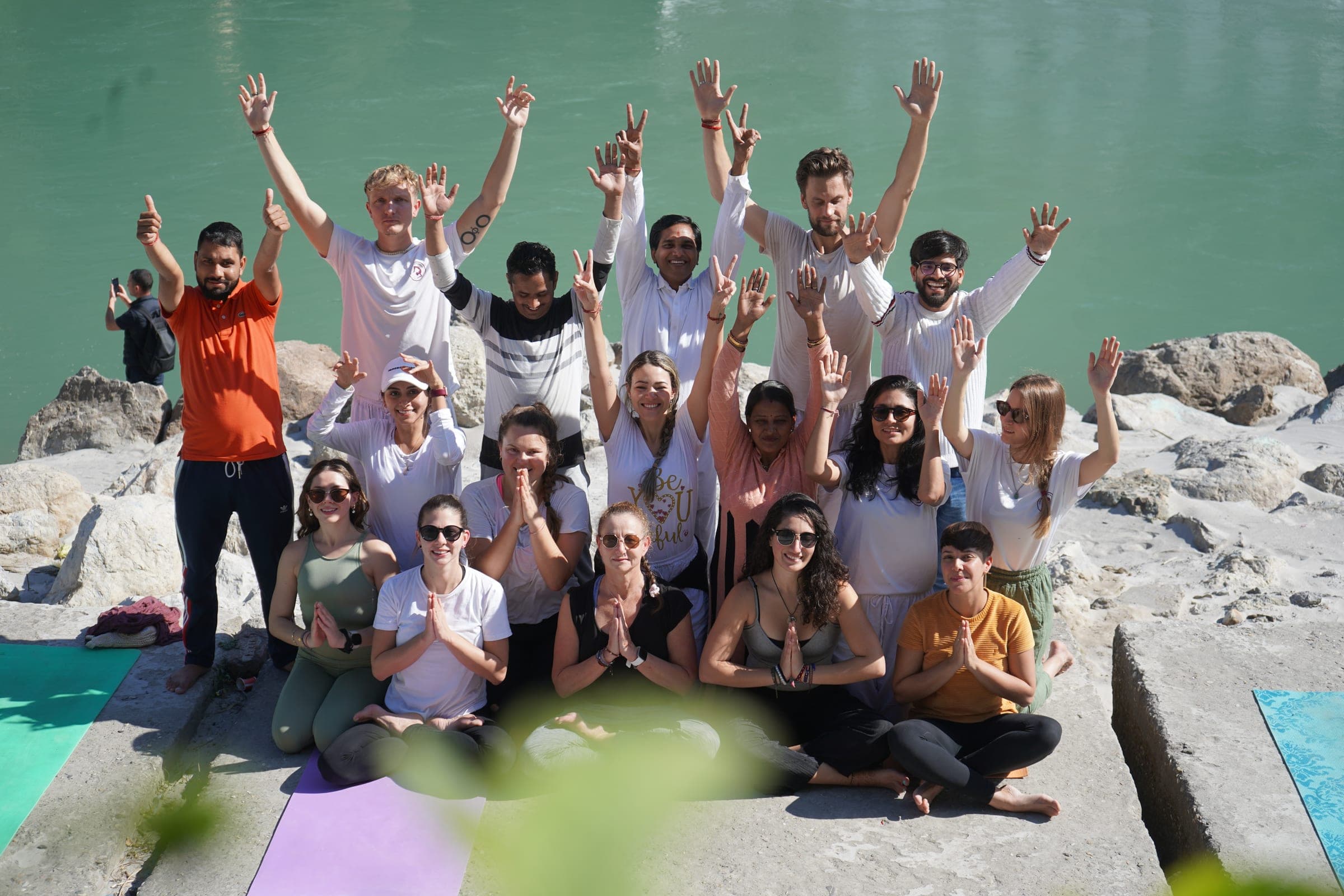 Arms up by the river on the last morning of a course