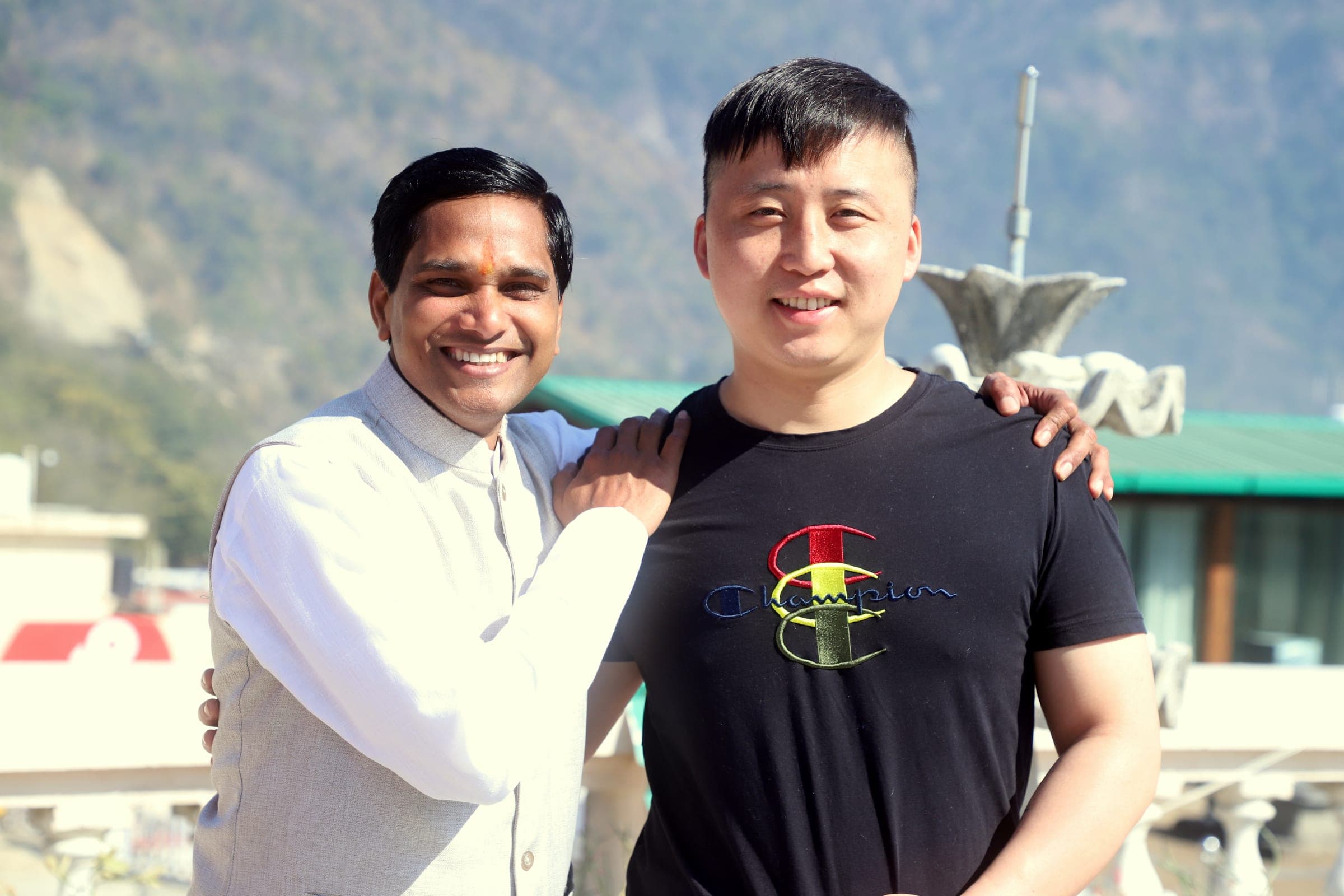 The founder and a student on the rooftop