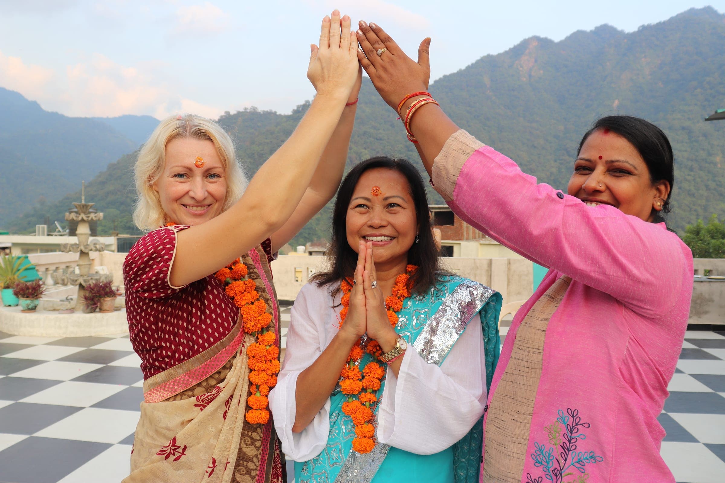 A high five on the terrace, garlands and all