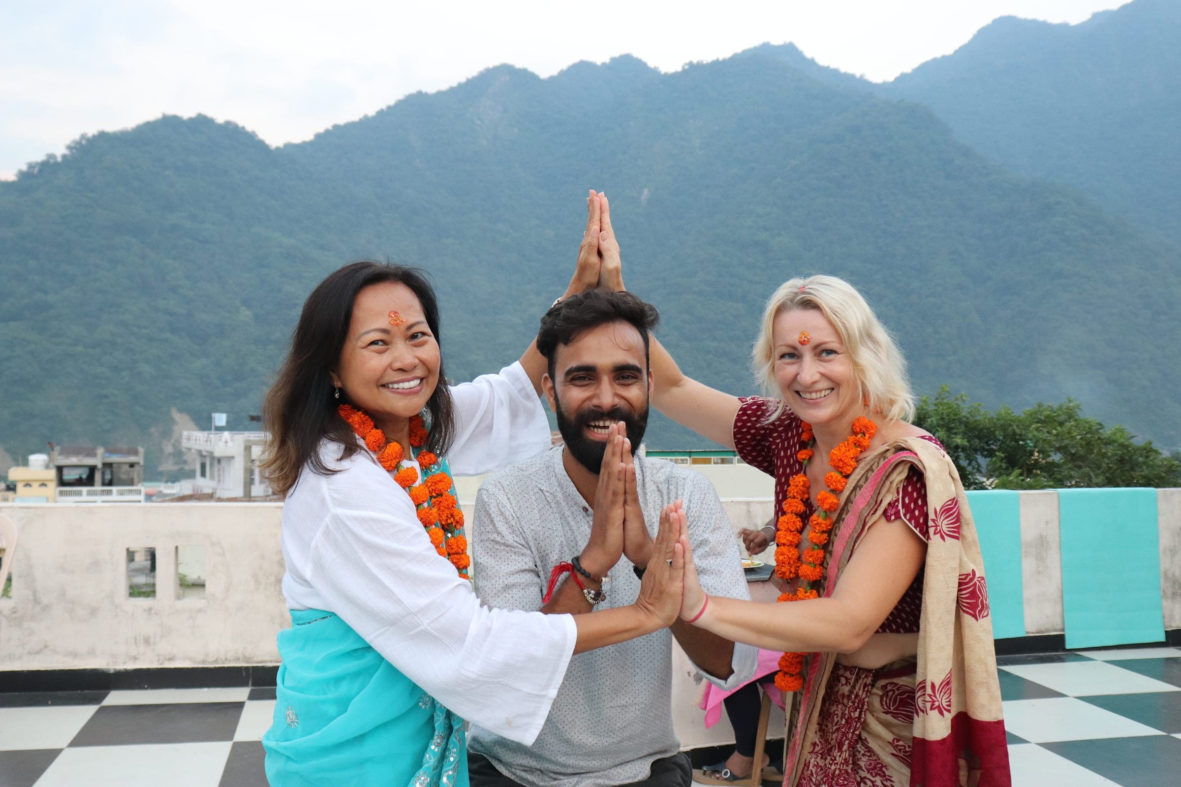 Three of us in namaste on the roof