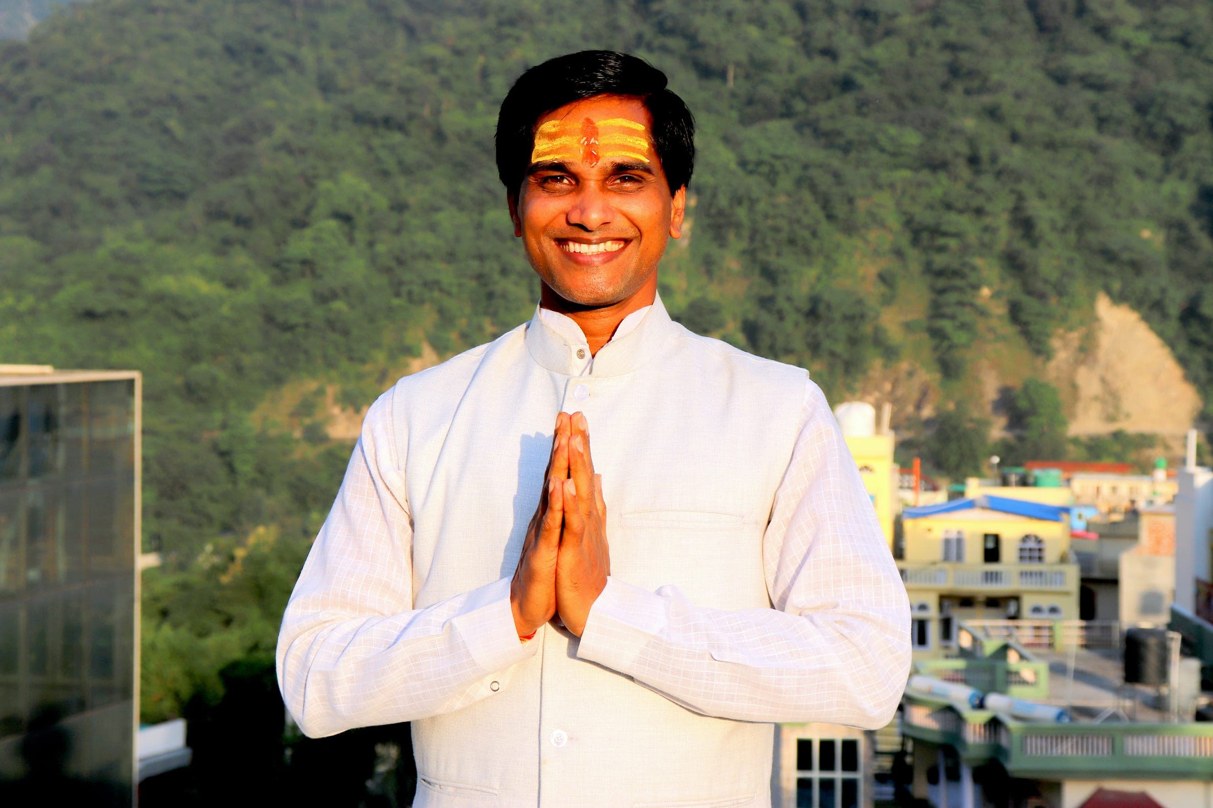 The founder in namaste above the town