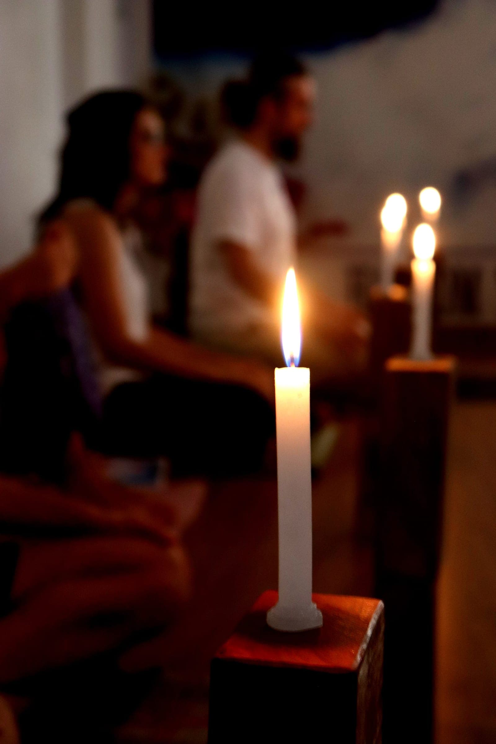 A candle burning through the meditation class