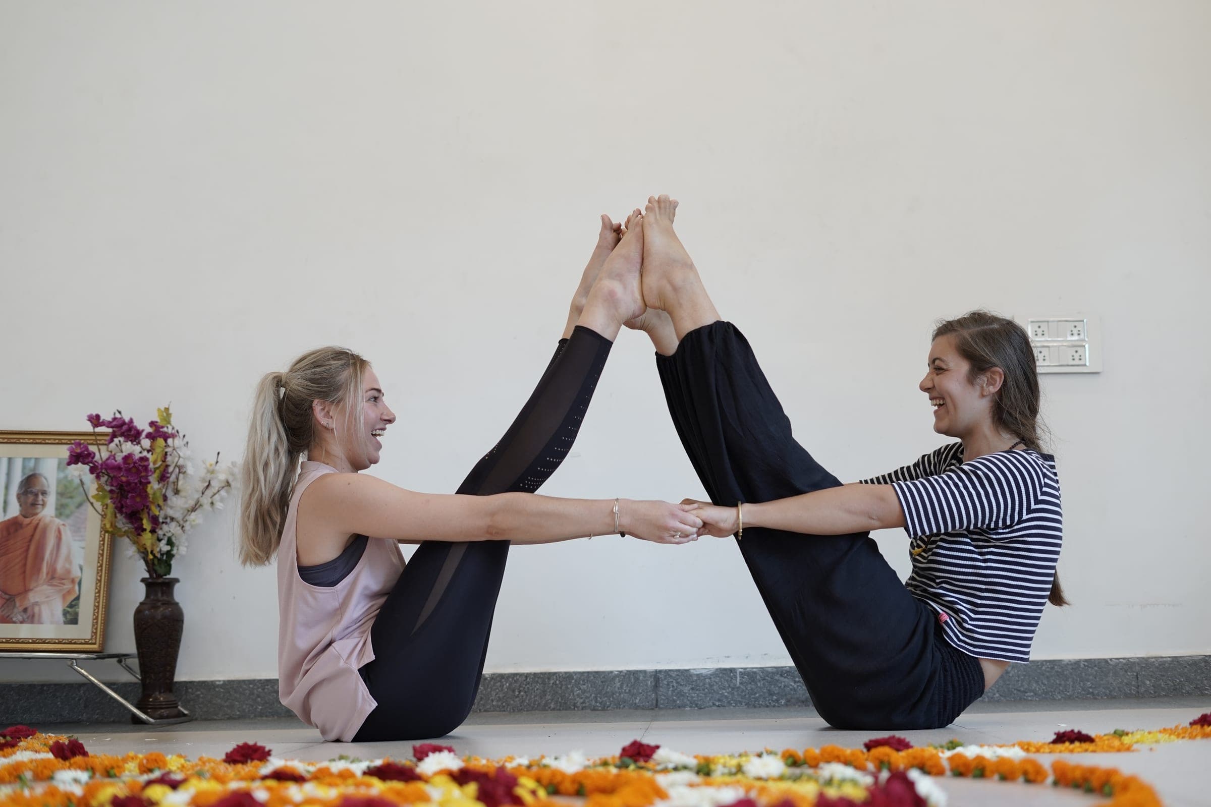 A boat pose shared sole to sole