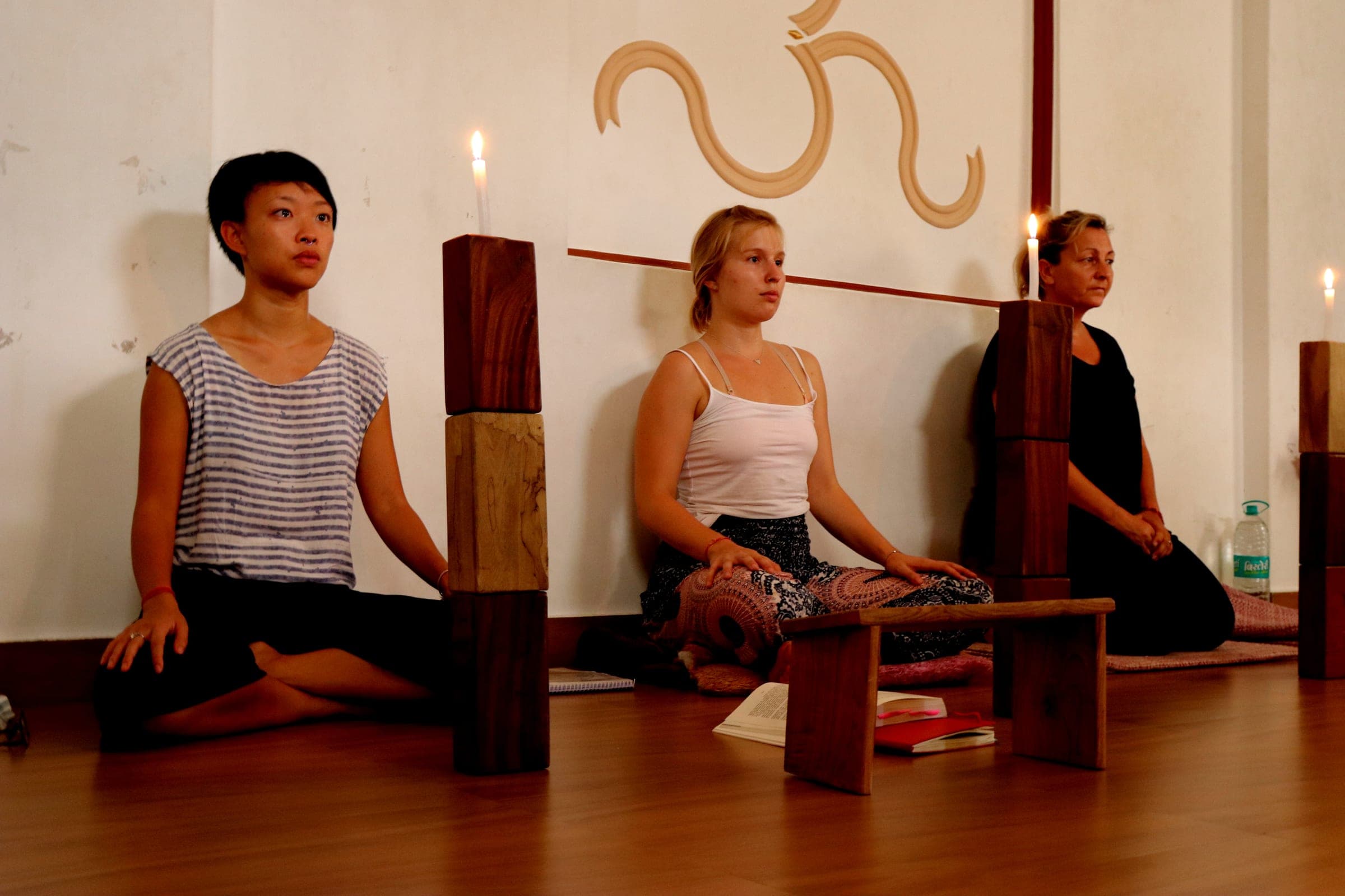 Meditation by candlelight in the hall