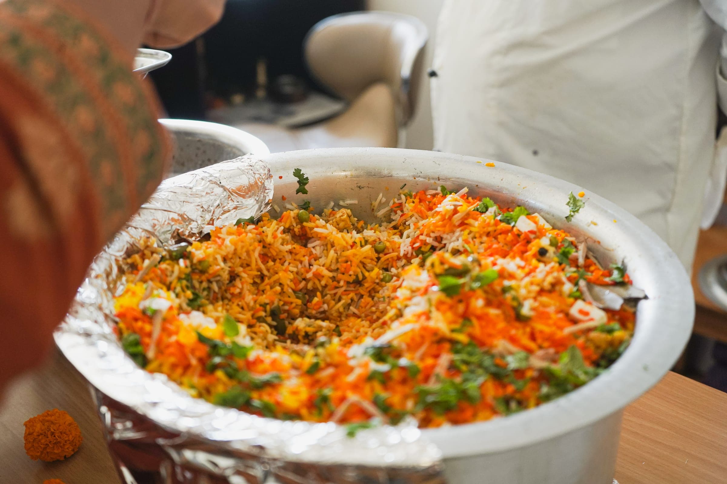 A full dish of rice brought out to the counter